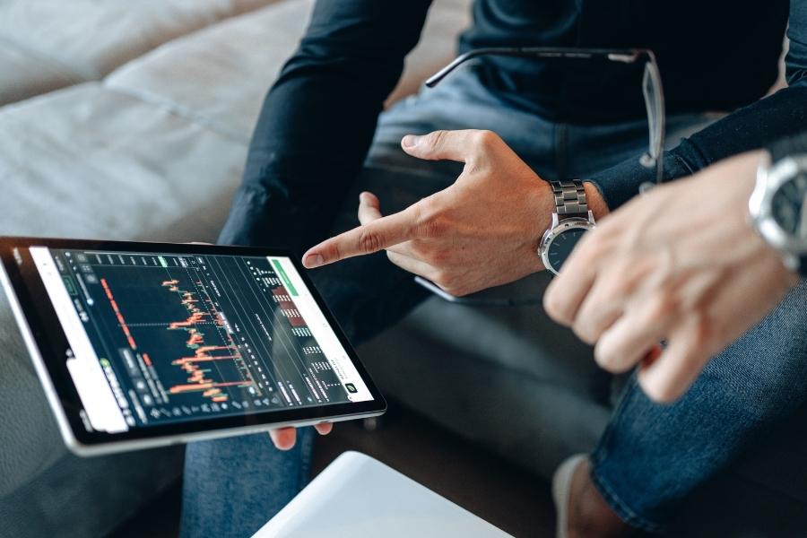 Business professionals analyzing digital transformation data on tablet device