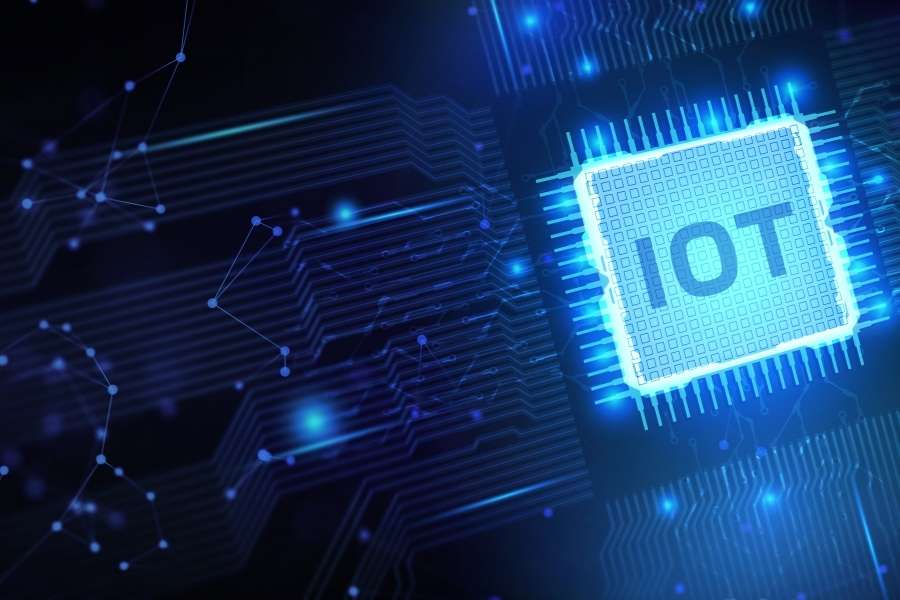 Glowing IoT microprocessor chip surrounded by blue circuit patterns and network connections